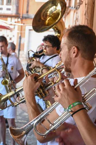 flugelhorn male band playing brass wind instrument outdoors musical instrument